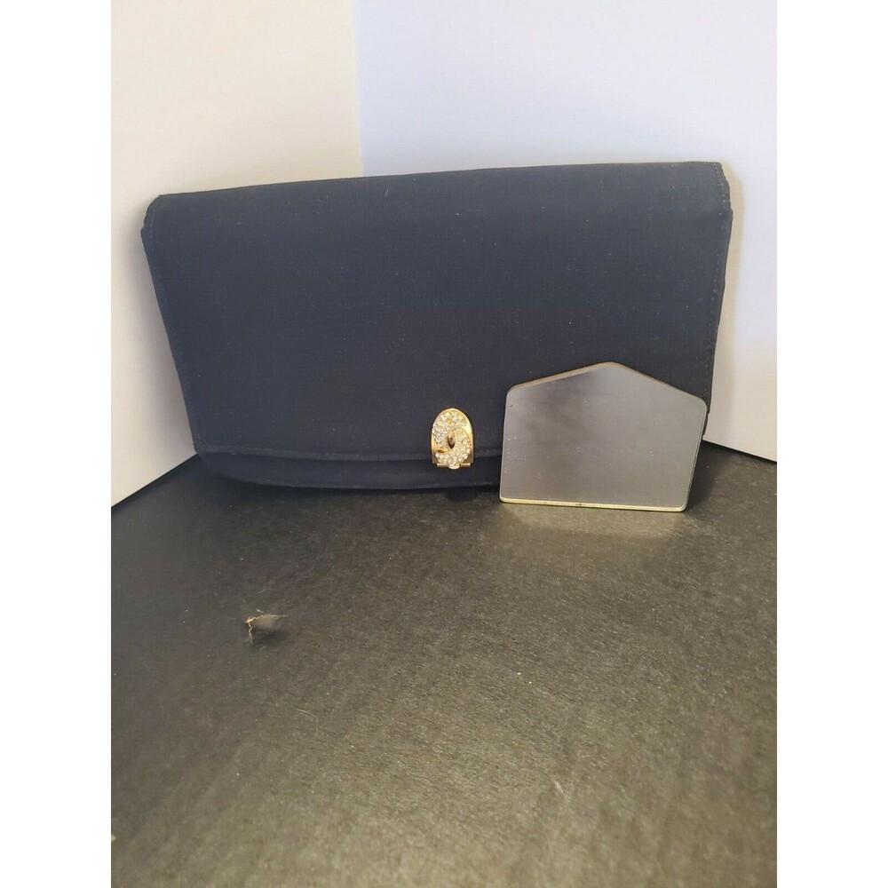 Garay Black Clutch, Includes mirror, one inner zippered pocket, One slip pocket.